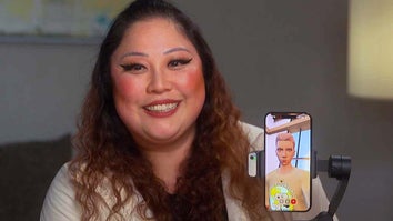 Woman smiling with her AI companion displayed on a cell phone